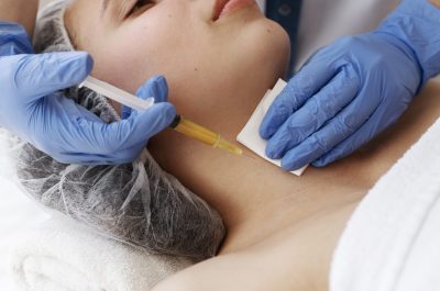 high-angle-woman-getting-neck-prp-treatment